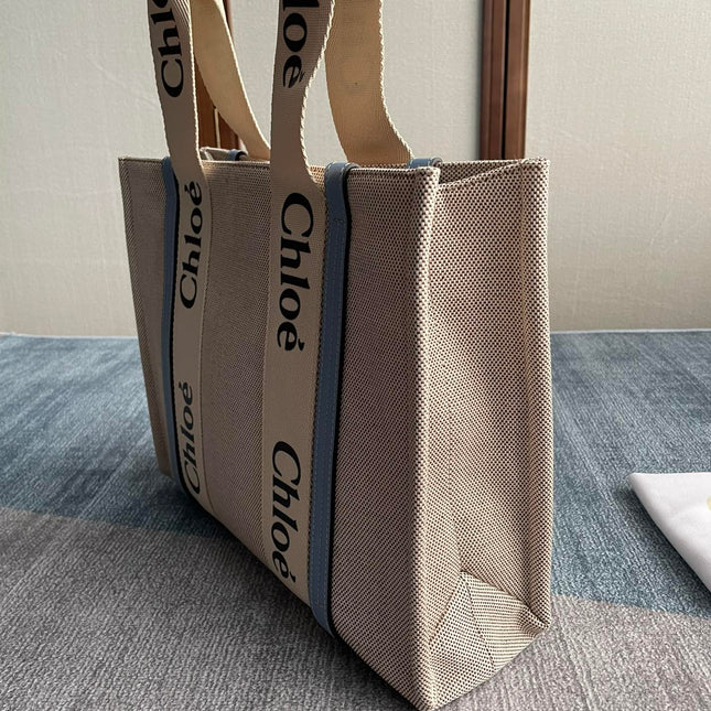 MEDIUM STRAP WOODY TOTE BAG 37 IN BEIGE LINEN CANVAS BLACK WEBBING LOGO EMBROIDER BLUE CALFSKIN