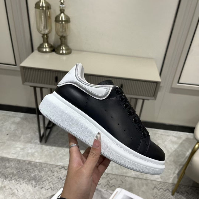 OVERSIZED SNEAKER IN BLACK CALFSKIN WITH SILVER STITCHED WHITE HEEL TAB