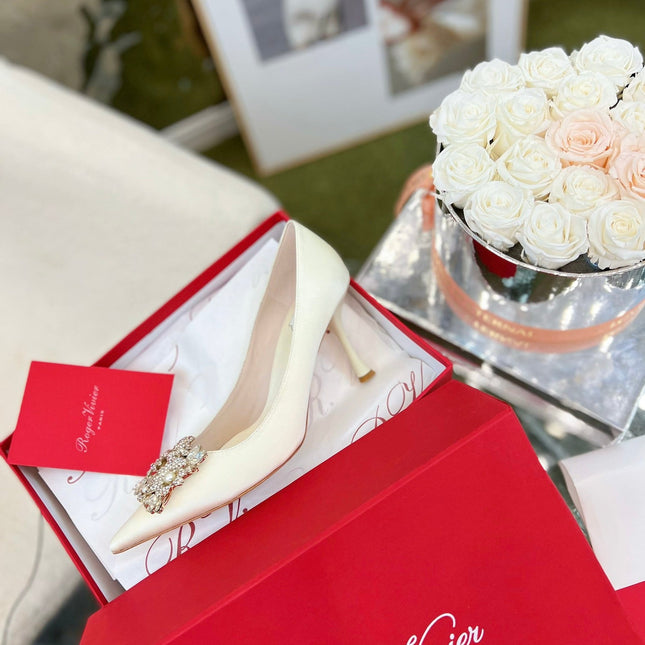 EFFLORESCENCE POINTED-TOE PUMPS IN WHITE SATIN WITH CRYSTAL BUCKLE