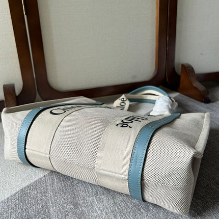 LAGRE WOODY TOTE BAG 45 IN BEIGE LINEN CANVAS BLACK WEBBING LOGO EMBROIDER BLUE CALFSKIN