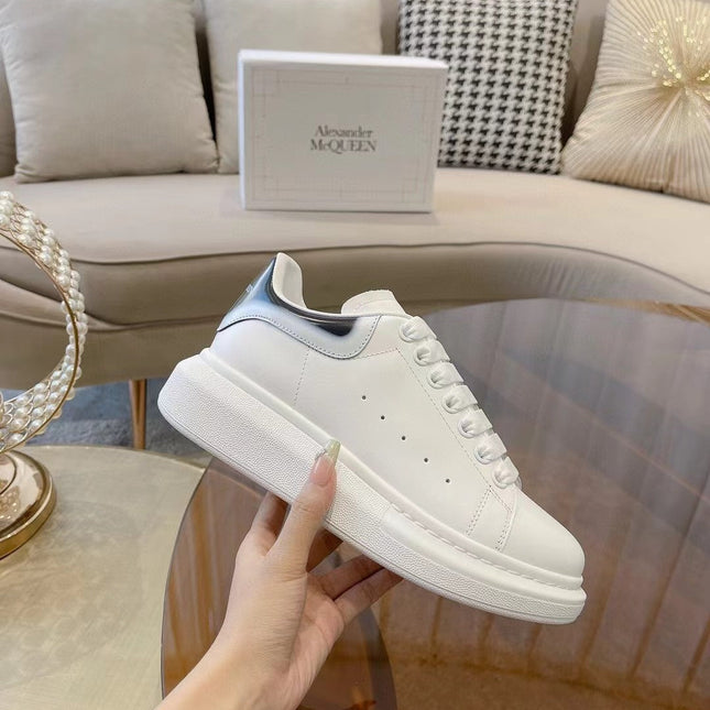 OVERSIZED SNEAKER IN WHITE CALFSKIN WITH GLOSSY BLACK AND WHITE HEEL TAB