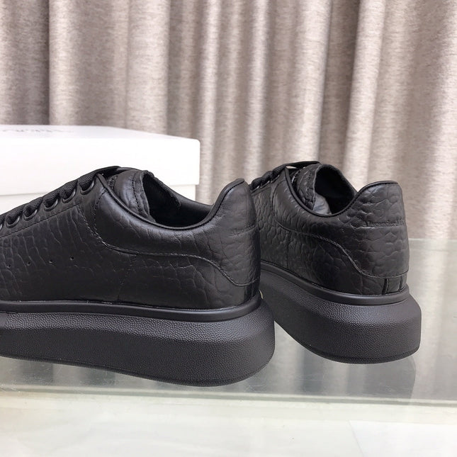 OVERSIZED SNEAKERS IN BLACK TEXTURED CALFSKIN EMBOSSED LOGO