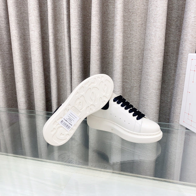 OVERSIZED SNEAKERS IN WHITE CALFSKIN WITH BLACK HEEL TAB