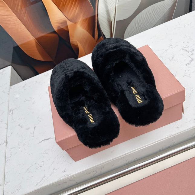 MIUMIU 26S MULES IN BLACK SHEARLING