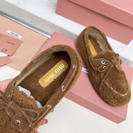 MIUMIU 26S BOAT LOAFERS IN BROWN SHEARLING