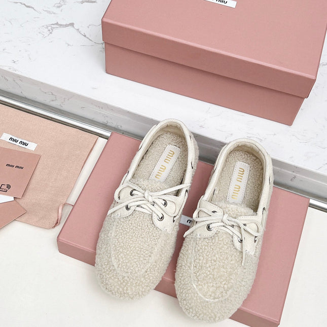 MIUMIU 26S BOAT LOAFERS IN BEIGE SHEARLING
