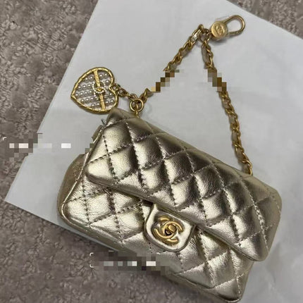 CC CLASSIC FLAP BAG 13 IN GOLD LAMBSKIN WITH PEARL HEART CHARM