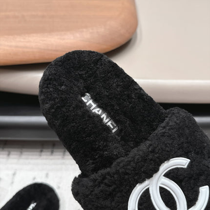 CHANEL 26S SLIDE MULES IN BLACK SHEARLING AND WHITE CC LOGO