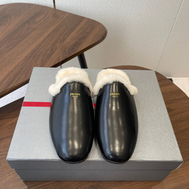 PRADA 25S CLOGS IN BLACK CALFSKIN FUR-LINED