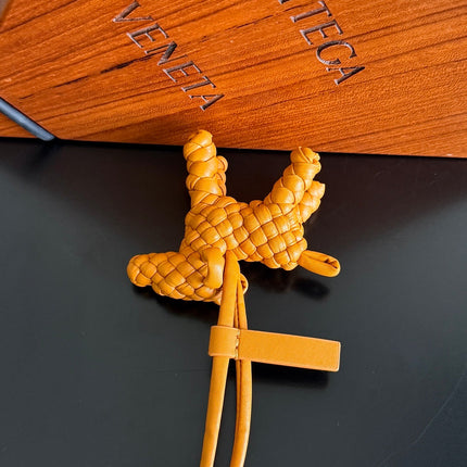BOTTEGA VENETA 25S DOG CHARM IN BURNT ORANGE CALFSKIN