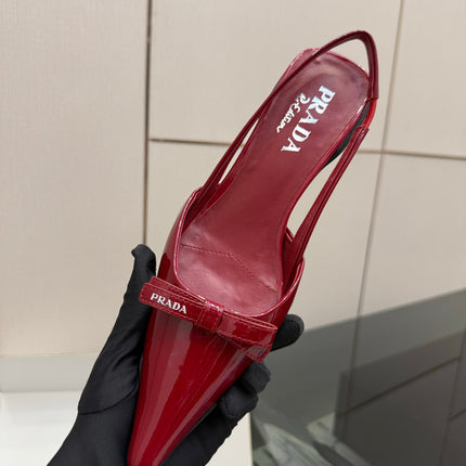 PRADA 26S BUCKLE STRAP SLINGBACK PUMPS IN DARK RED PATENT CALFSKIN WITH BOW