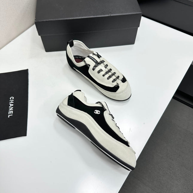 CHANEL SNEAKERS METIERS D-ART 26S IN BLACK AND WHITE SUEDE