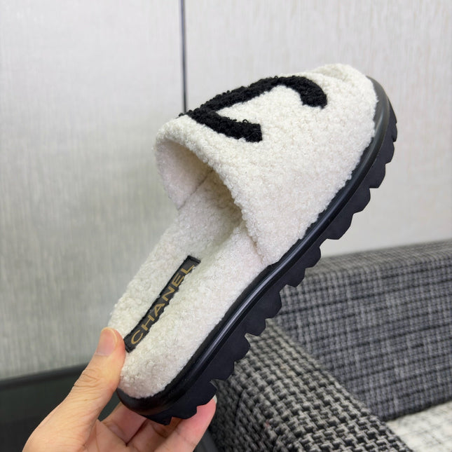CHANEL 26S SLIDE SANDALS  IN BLACK AND WHITE SHEARLING