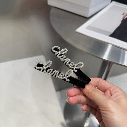 CHANEL 26S BOW HAIR CLIP IN BLACK RHINESTONE SCRIPT 505309