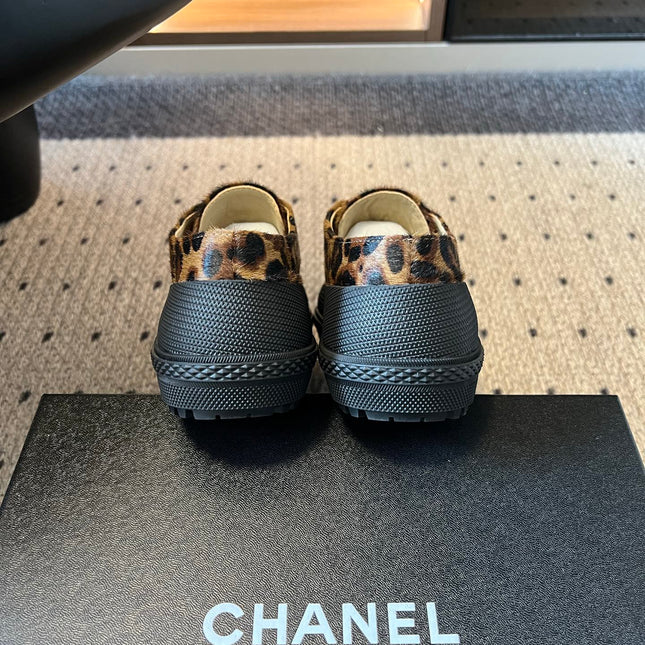 CHANEL 26S LACE UP SNEAKERS IN BLACK CALFSKIN AND BROWN PONY HAIR LEOPARD PRINT