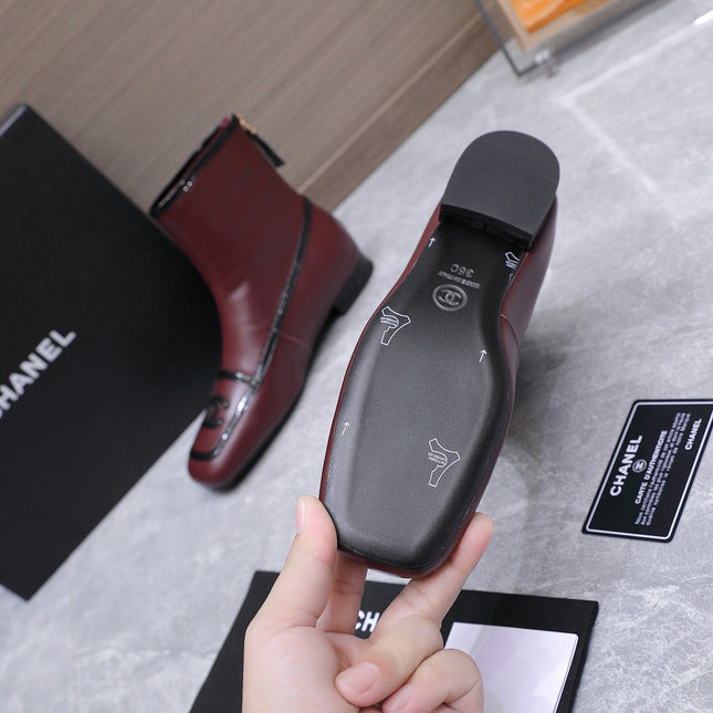 CHANEL 26S ANKLE BOOTS IN BURGUNDY CALFSKIN WITH BLACK PATENT LEATHER TRIM AND CC LOGO ON TOE CAP