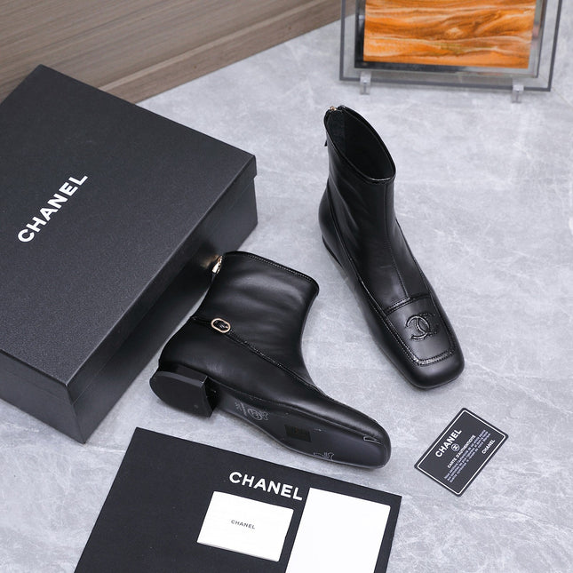 CHANEL 26S ANKLE BOOTS IN BLACK CALFSKIN WITH PATENT LEATHER TRIM AND CC LOGO ON TOE CAP