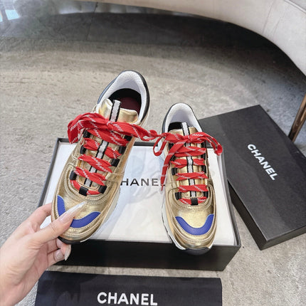 CHANEL 26S COLORBLOCK LOW TOP SNEAKERS IN GOLD CALFSKIN AND RED