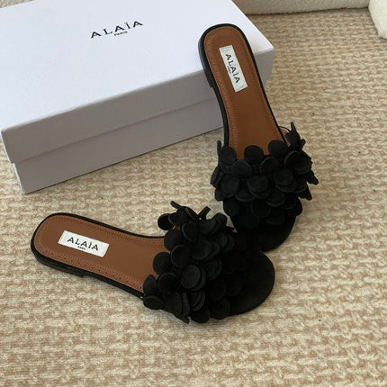 ALAIA FLAT MULE IN BLACK SUEDE