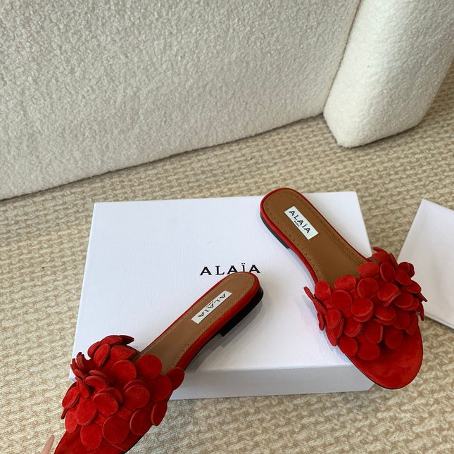 ALAIA FLAT MULE IN CHERRY RED SUEDE