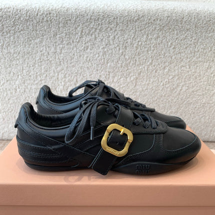 GYMNASIUM SNEAKER IN BLACK CALFSKIN WITH GOLD BUCKLED STRAP