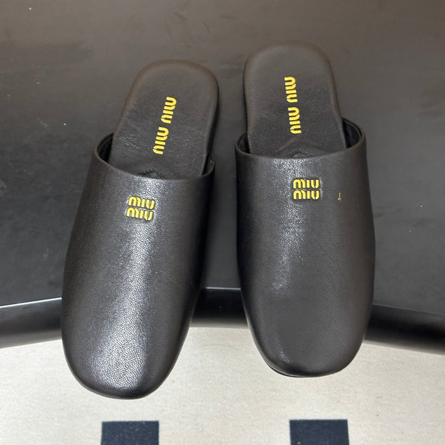 MIUMIU 26S MULE LOAFERS IN BLACK CALSKIN