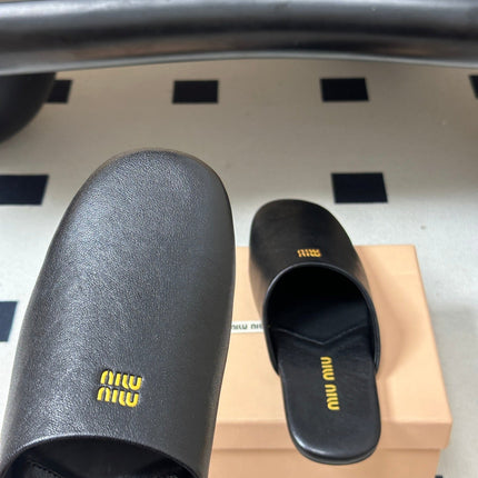 MIUMIU 26S MULE LOAFERS IN BLACK CALSKIN
