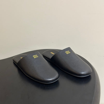 MIUMIU 26S MULE LOAFERS IN BLACK CALSKIN