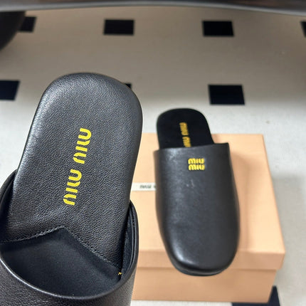 MIUMIU 26S MULE LOAFERS IN BLACK CALSKIN