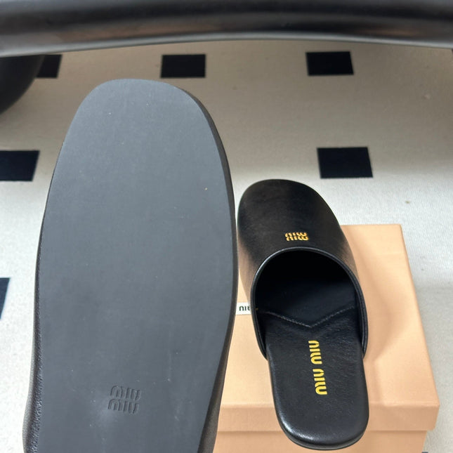MIUMIU 26S MULE LOAFERS IN BLACK CALSKIN