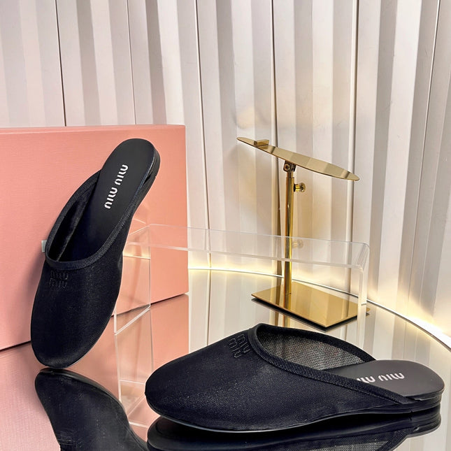 MIUMIU 26S FLAT MULES IN BLACK FABRIC AND LEATHER 