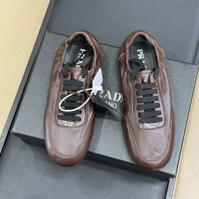 PRADA 25S COLLAPSE FLAT SHOES IN DARK BROWN CALFSKIN