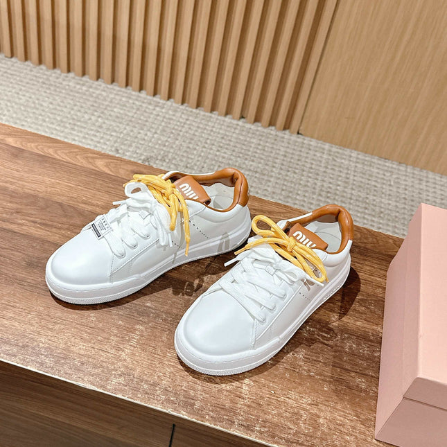 MM SNEAKERS IN WHITE CALFSKIN WITH YELLOW LACES