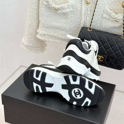CHANEL 26S COLORBLOCK LOW TOP SNEAKERS IN WHITE CALFSKIN AND BLACK SUEDE