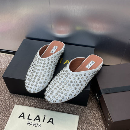 ALAIA FLAT MULES 25S IN WHITE LAMBSKIN EMBELLISHED WITH CRYSTALS