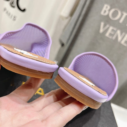 ALAIA FLAT MULES IN LIGHT PURPLE MESH FISHNET