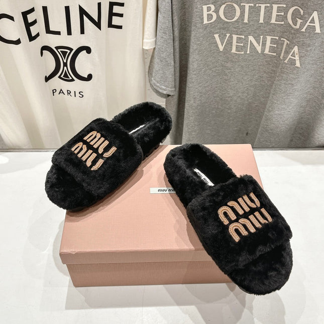 MIUMIU 26S FLAT SLIDES IN BLACK SHEARLING