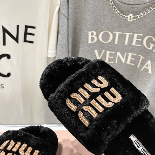 MIUMIU 26S FLAT SLIDES IN BLACK SHEARLING
