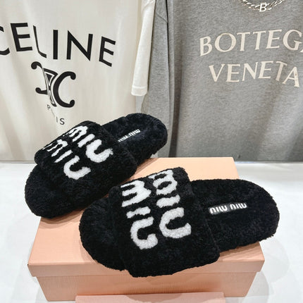 MIUMIU 26S SANDALS IN BLACK SHEARLING WITH LOGO LETTERING
