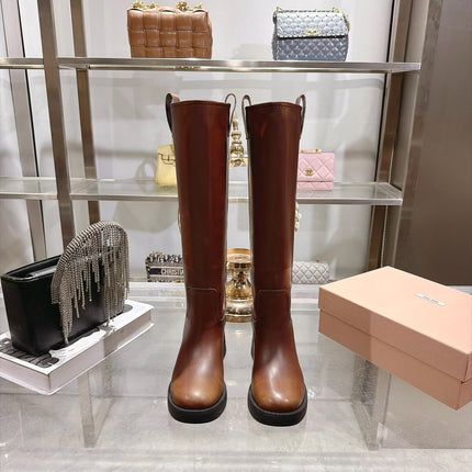 MIUMIU 26S KNEE HIGH BLOCK HEEL BOOTS 50MM IN COGNAC BROWN CALFSKIN